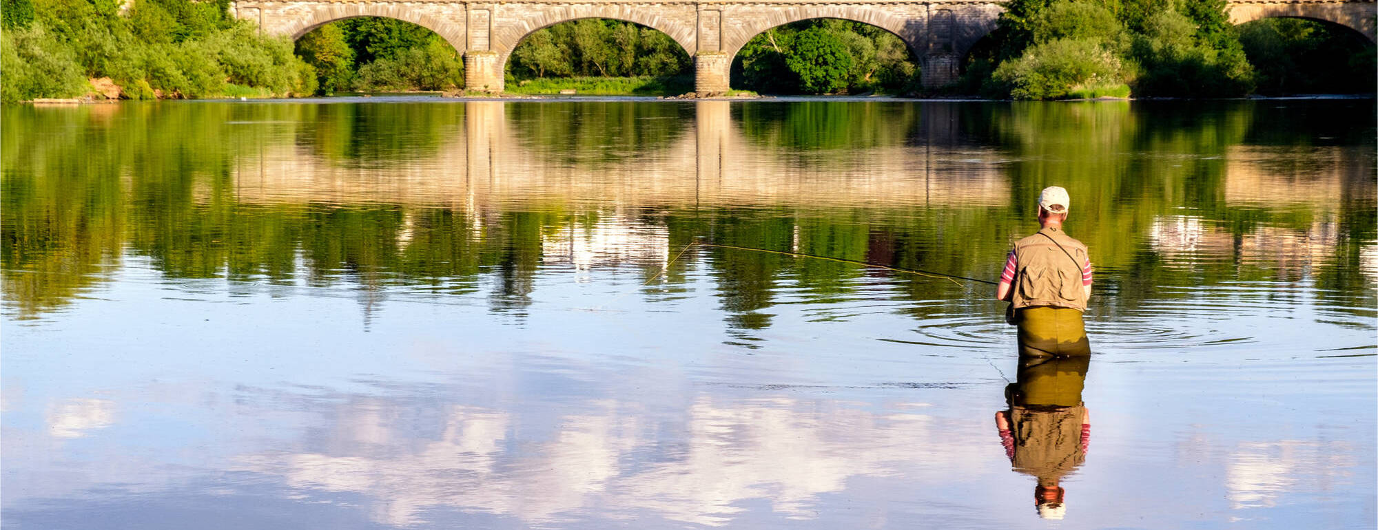 Man fishing in the River Tweed